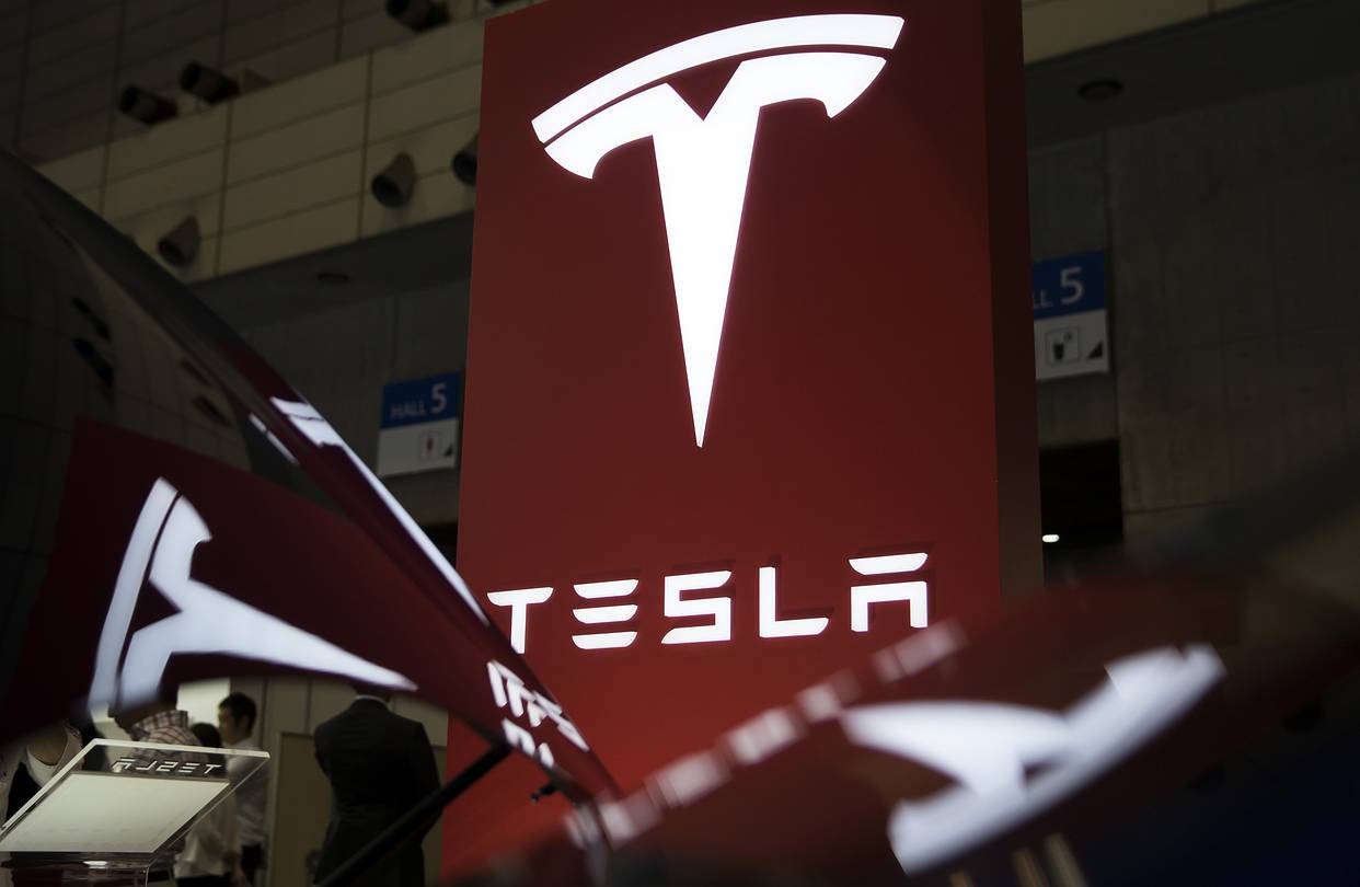 Trading platform interface showing Tesla and EV market data
